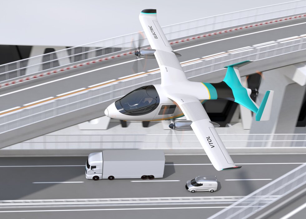 Electric VTOL cargo delivery aircraft, Electric Truck and minivan moving on highway